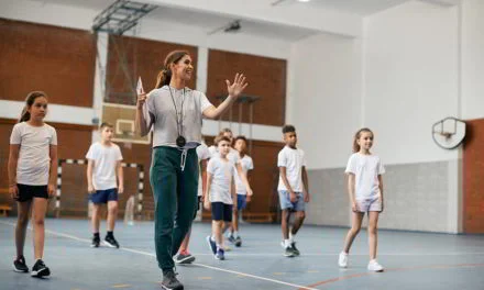 How does a PE teacher raise the coaching and officiating with students?